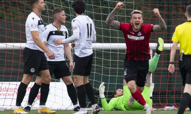 Elgin's Darryl McHardy (R) celebrates scoring against Edinburgh City in the play-offs last season.