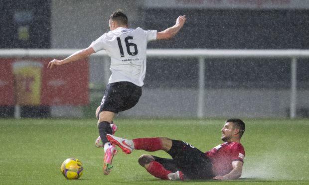 Elgin's Matthew Cooper (R) and Edinburgh's Josh Campbell during the Scottish League One play-off semi final.