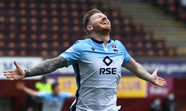 Michael Gardyne celebrates his winner for Ross County against Motherwell.