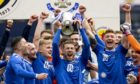 St Johnstone's David Wotherspoon lifts the Scottish Cup after defeating Hibs in the final.