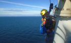 A PD&MS rope access technician working on a wind farm off the coast of Scotland.