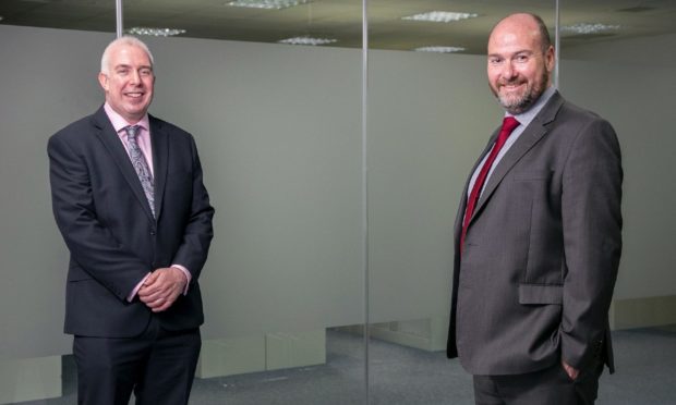 Angus McCuaig, managing partner at Hardie Caldwell (left) and Graeme Allan, chief executive at Anderson Anderson announce a merger of the two firms.