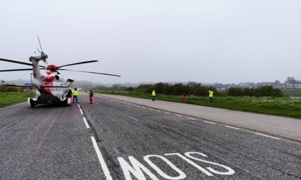 Prestwick Coastguard Helicopter was forced to land at Aberdeen Beach after foggy conditions hampered their ability to land at Aberdeen Royal Infirmary.  Picture: HM Coastguard