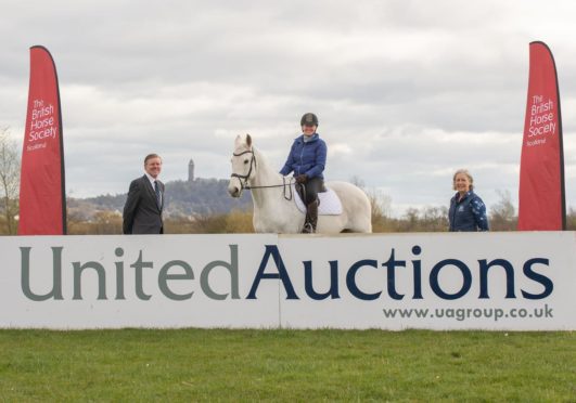 From left: United Auctions' Christopher Sharp, BHS member Shonagh Robb on her horse Platinum Cracker and Helene Mauchlen of the British Horse Society.