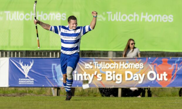 Newtonmore's Glen Mackintosh celebrates one of his goals in the Tulloch Homes Camanachd Cup final against Oban Camanachd in 2019.