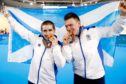 Scotland's Neil Fachie (left) and pilot Matt Rotherham (right) celebrate with their gold medals after the Men's B&VI Sprint Final at the Anna Meares Velodrome during day Three of the 2018 Commonwealth Games in the Gold Coast, Australia. PRESS ASSOCIATION Photo. Picture date: Saturday April 7, 2018. See PA story COMMONWEALTH Cycling. Photo credit should read: Martin Rickett/PA Wire. RESTRICTIONS: Editorial use only. No commercial use. No video emulation.