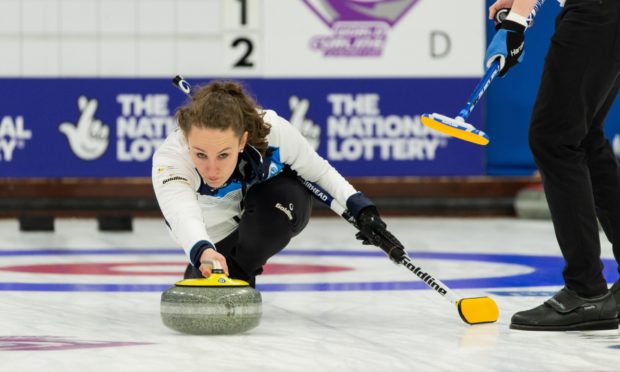 Jen Dodds delivering a stone in Scotland's opening match of the World Mixed Doubles Curling Championship