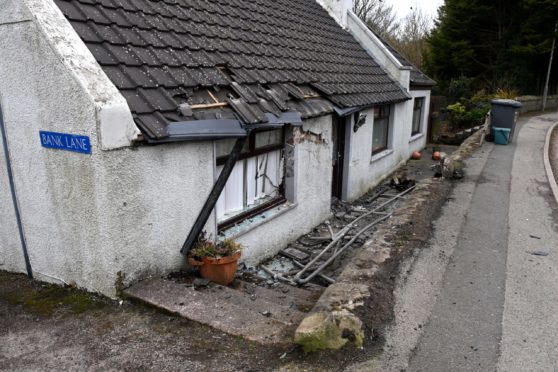 A car crashed into the property in Longside early today