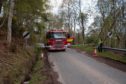 To go with story by Annie Butterworth. Man missing and feared dead after house fire in near Dores Picture shows; Dores hill police cordon. Dores, Inverness. Paul Campbell Date; 04/05/2021