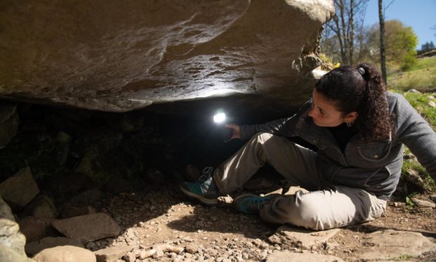 Joana Valdez-Tullett, post-doctoral research assistant on Scotland’s Rock Art Project, looking at prehistoric carvings found at Kilmartin Glen.