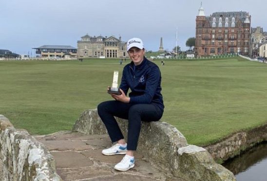 Hannah Darling takes the traditional winners' seat on the Swilcan Bridge.