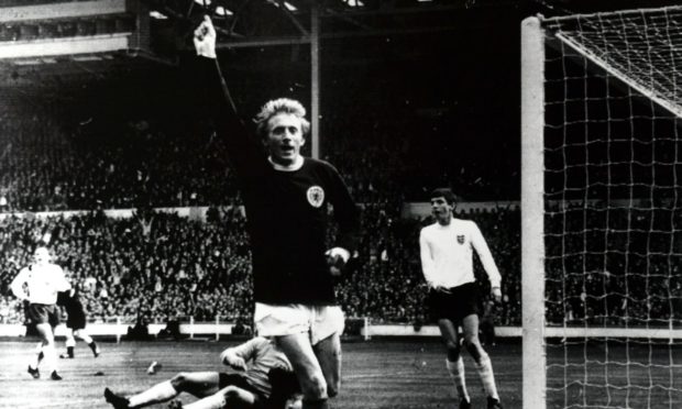 Denis Law memorabilia showing the Aberdeen-born footballer in his iconic pose