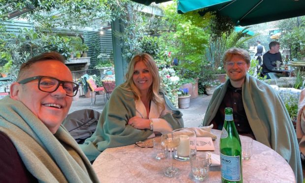 Yvie enjoying a meal at The Ivy with husband Gordon and son Ollie.