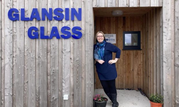 Glassmaker Cheryl Jamieson outside the new visitor centre.