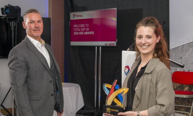 L-R Steve McIntosh, Healthoutfit managing director & Chelsea Page, team leader collecting the award
