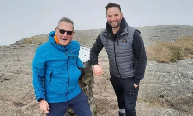 To go with story by Ellie Milne. Neil McArthur is climbing Bennachie every day in May to raise money for charity. Picture shows; Neil McArthur and Ben Riddell at Bennachie. Bennachie. Supplied by Ben Riddell Date; 08/05/2021