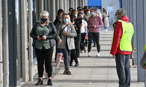 Large queues have been forming outside the Fiona Elcock Centre in Elgin.