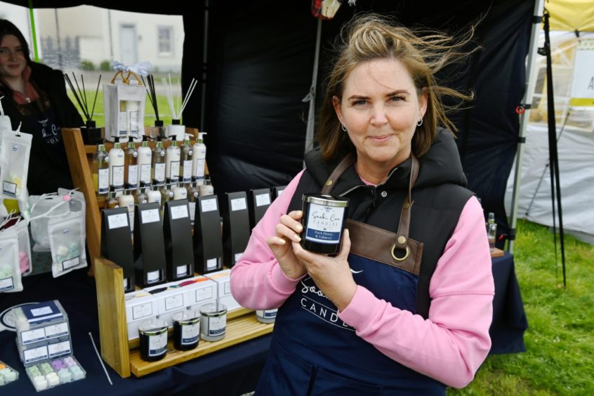 CR0028341
Food and Drink - Chapelton farmers' market at Burgess Park, Chapelton, Aberdeenshire.
Picture of Sooki Coo Candle Stall - Jackie Anderson.

Picture by Kenny Elrick     23//2021