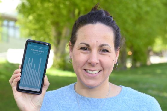 Laura Stewart with a step tracker app