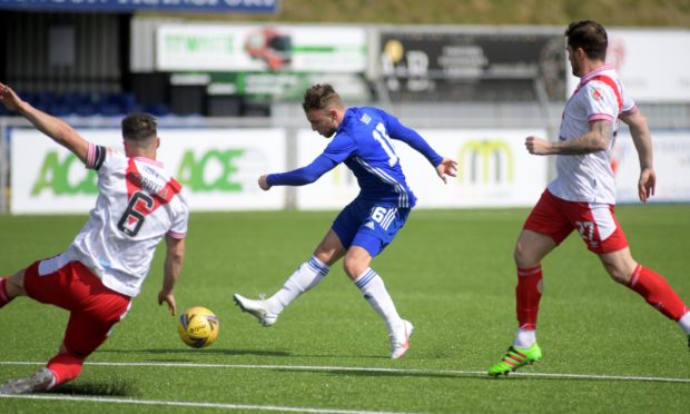 Cove Rangers' Seb Ross takes aim against Airdrieonians.