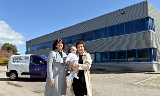 Co-founder Michelle Herd, founder Danielle Flecher-Horn and little Albie Horn outside the AberNecessities headquarters on Howe Moss Road, Dyce.
Picture by KATH FLANNERY