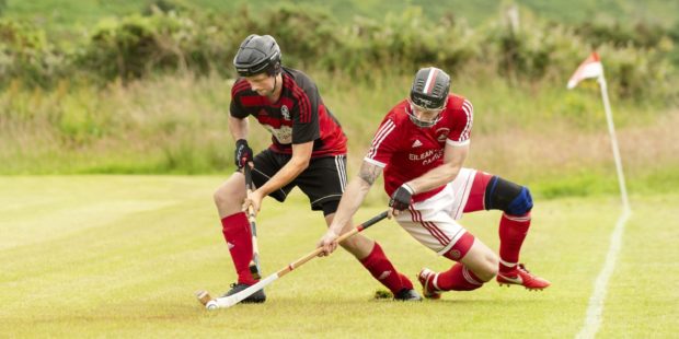 Andrew MacCuish tries to get away from Conor Cormack of Kinlochshiel.