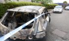 Petrol was poured on four cars at 2am this morning in St Clement St, Aberdeen, which caused two cars to catch on fire. Picture by Paul Glendell
