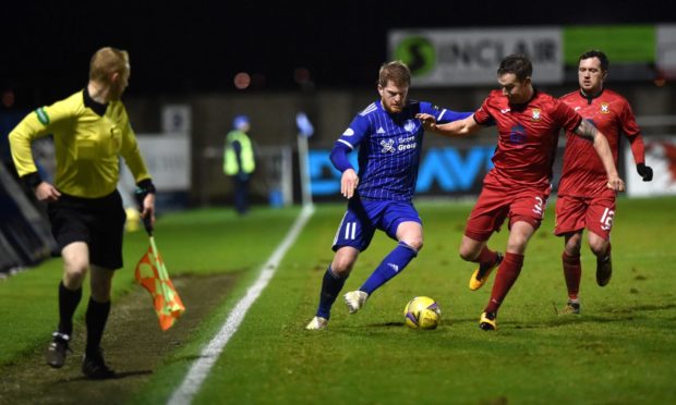 Alan Cook, centre, is staying with Peterhead next season