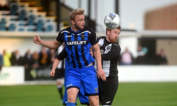 Ross Still, left, in action for Huntly