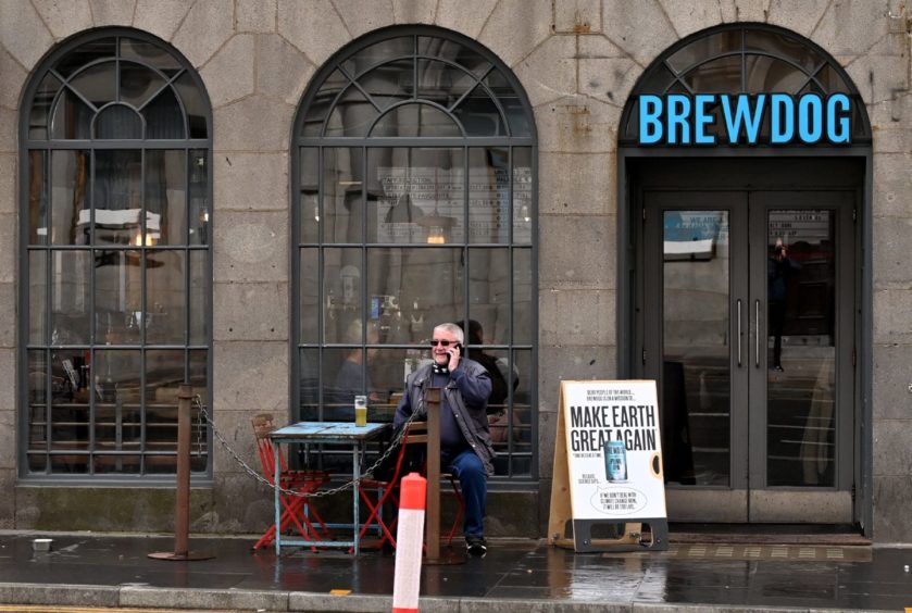 A man enjoys a drink at BrewDog Castlegate.