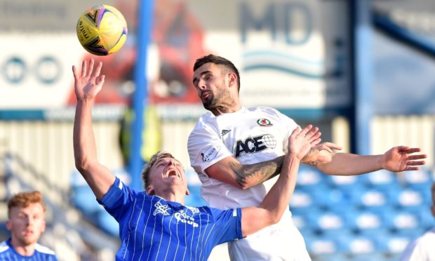 Cove Rangers defender Scott Ross, right, in action against Peterhead.