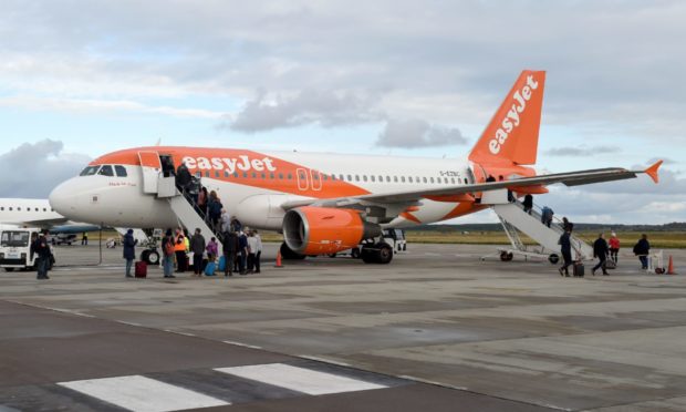 Two men and a woman were arrested upon arrival at Gatwick Airport in London.