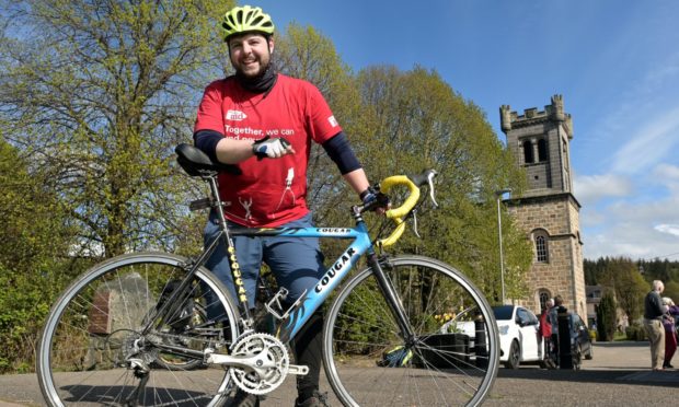 Reverend Andrew Kimmitt of Aberlour passes through the village on Saturday afternoon on the last leg of his one day run, cycle and kayak from Loch Spey to the rivers mouth at Spey Bay in aid of Christian Aid.