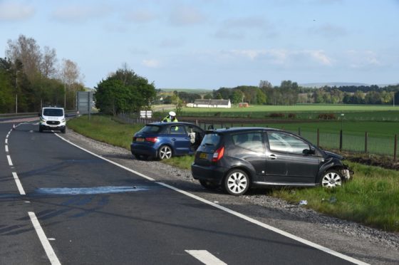 The vehicles at the scene on the A9. Picture by Sandy McCook