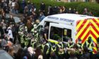 Police enter an immigration van in Kenmure Street, Glasgow which is surrounded by protesters. Picture date: Thursday May 13, 2021. PA Photo. Police were called to the Glasgow street where it is understood protesters were trying to prevent immigration officers from removing people from a property. See PA story POLICE Kenmure. Photo credit should read: Andrew Milligan/PA Wire