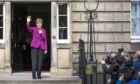 Scottish First Minister and SNP leader Nicola Sturgeon on the steps of Bute House in Edinburgh after the SNP won a fourth victory in the Scottish Parliament election. Picture date: Sunday May 9, 2021. PA Photo. The SNP fell one seat short of an overall majority in the Scottish parliament elections, securing 64 seats, but the final result still leaves Holyrood with a pro-independence majority. See PA story POLITICS Elections Scotland. Photo credit should read: Jane Barlow/PA Wire
