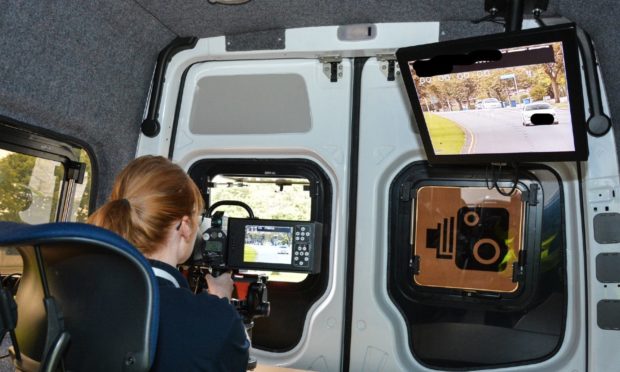 Police staff working in a speed camera unit