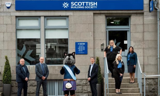 The SBS Aberdeen team launch the new branch. (L to R) Paul Denton, Alan Chapman, SBS mascot Hamish, Douglas Sharpe, Samantha Bain, Mhari Crawford and Reena Bell.