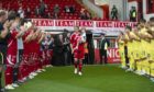 Aberdeen's Darren Mackie receives a   warm welcome from the crowd in his testimonial.