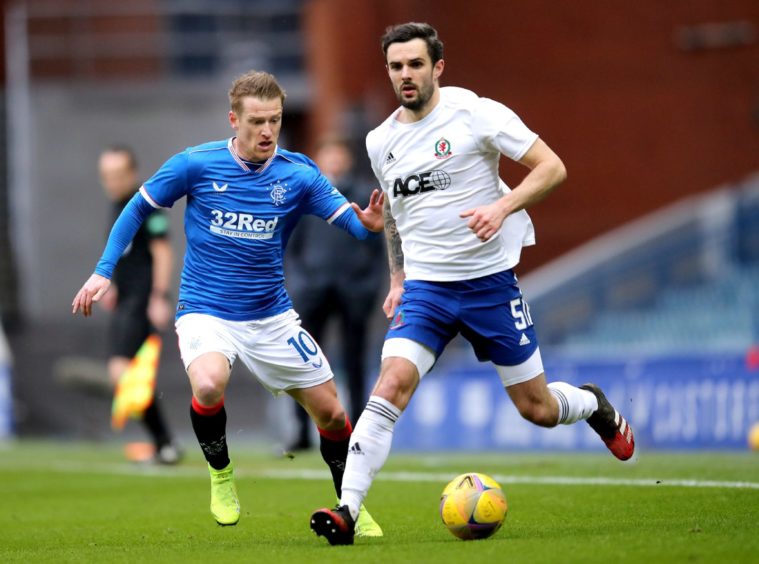 Cove Rangers' Scott Ross (right) in action against Rangers.