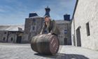 Master distiller Stewart Bowman filled the first cask of spirit to mark Brora Distillery's reopening.