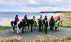 Traigh Mhòr Pony Trekking staff and members of its Junior Saddle Club.