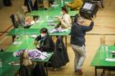 The Courier, CR0028093, News, Emma O'Neill story, the count has started at Dundee's DISC today for Dundee West. Picture shows; general shots of the first ballot boxes being tipped out as the count assistants start to do their bit. Friday 7th May, 2021. Mhairi Edwards/DCT Media