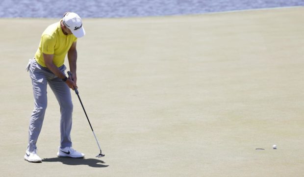 Martin Laird's par putt just lipped out on the tough 17th.