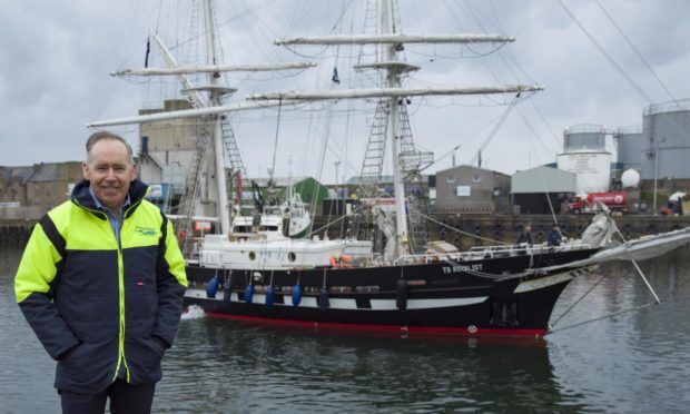 Peterhead Port Authority chief executive Simon Brebner, with Sea Cadets' ship TS Royalist behind him.