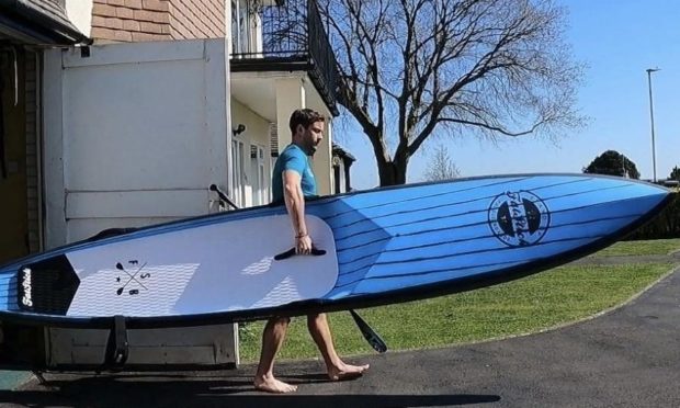 David Haze armed with his trusty paddle board
