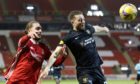 Aaron Taylor-Sinclair, right, in action against Aberdeen earlier this season