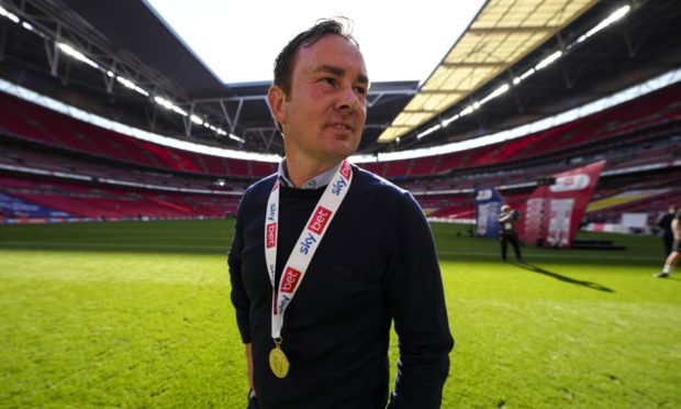 Derek Adams with his League Two final medal at Wembley.
Picture by Joe Toth/BPI/Shutterstock