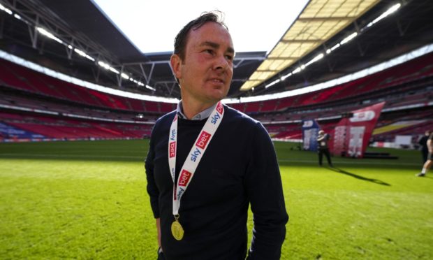 Derek Adams with his League Two final medal at Wembley.
Image: Shutterstock.