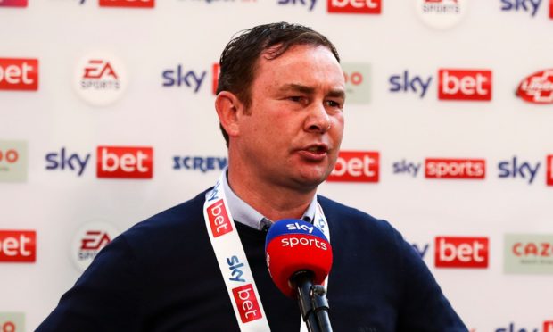 Derek Adams after leading Morcambe into League One after a play-off final win at Wembley. Image: Shutterstock.